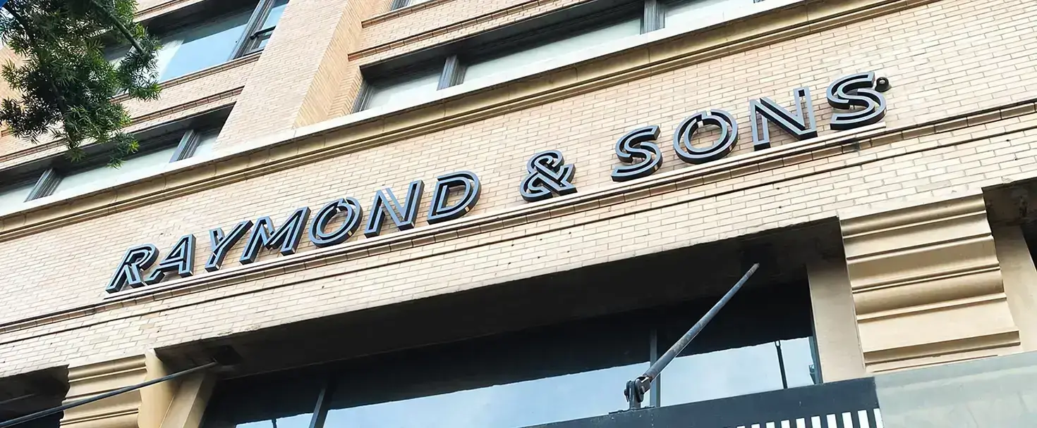 Signarama dimensional channel letter storefront sign installed on a commercial building facade