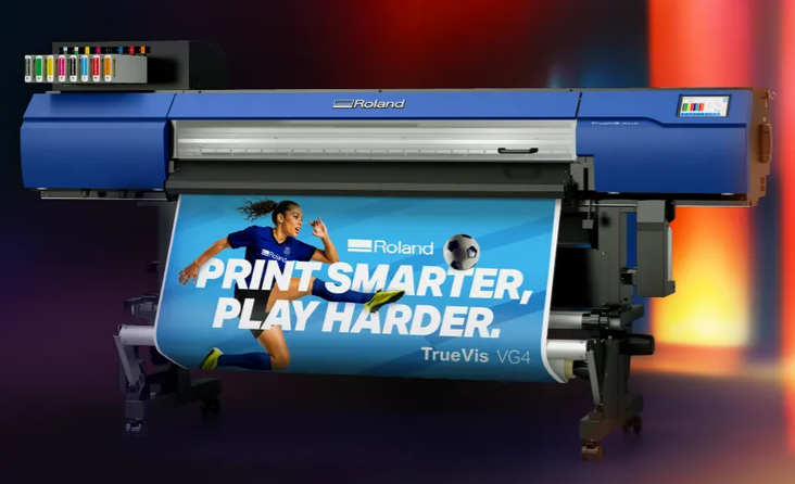 Roland TrueVis VG4 wide-format printer producing a promotional banner for LaserTek Solutions clients